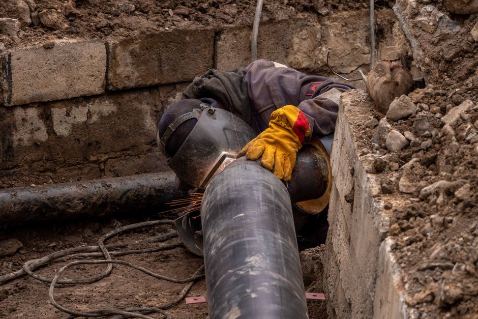 Close-up of a drainage pipe being inspected for repair in Surrey